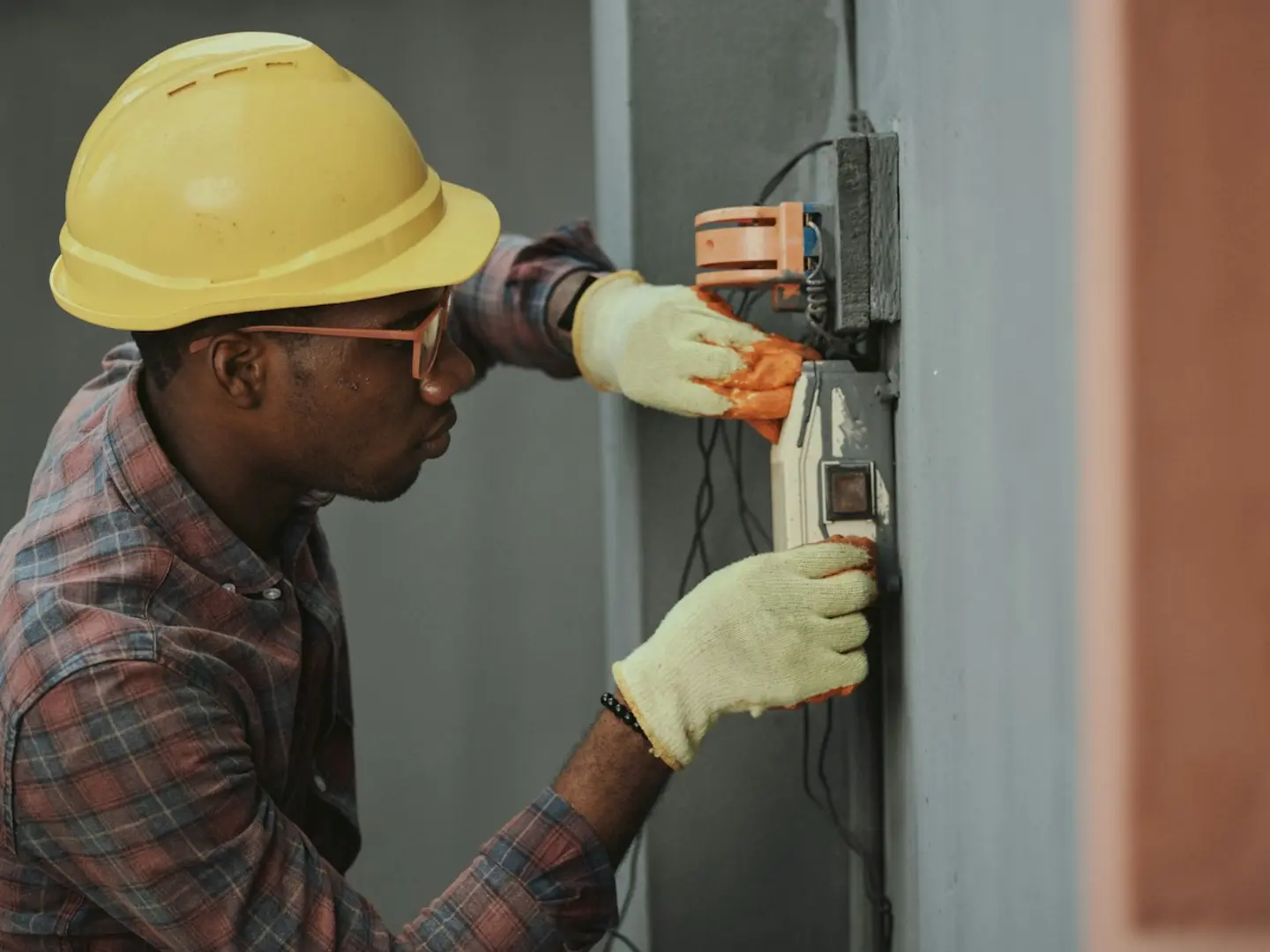 Qualified tradesperson carrying out electrical work